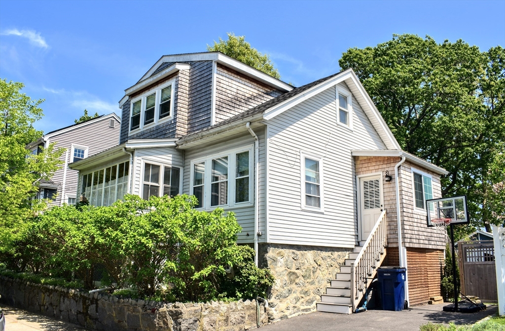 12 Searle Road, Unit 12 Boston, MA 02132 - Photo 12 of 35 a front view of a house with a yard