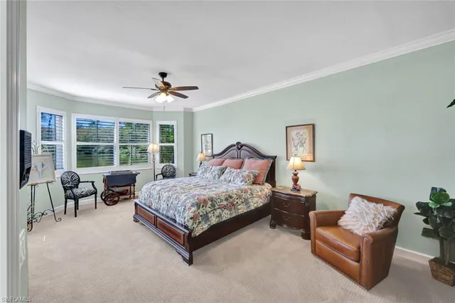 a bed room with a bed and a large window