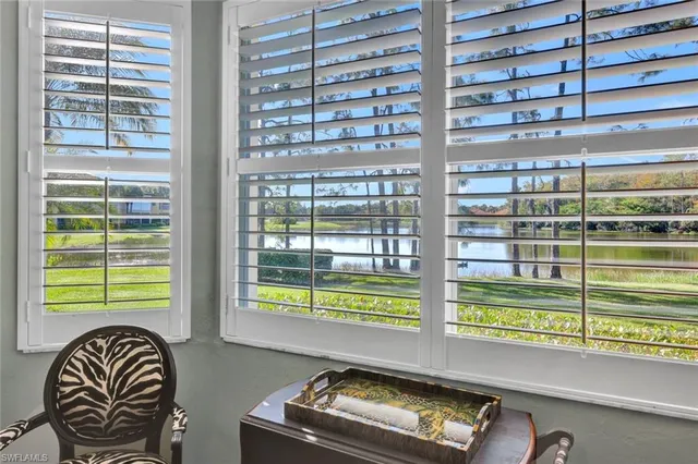 a bedroom with bed and window