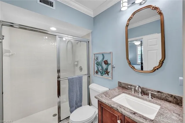 a bedroom with a bed and a potted plant