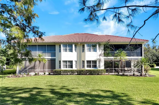 an aerial view of a house with a lake view
