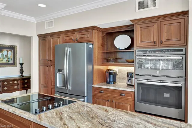 a kitchen with a sink and wooden cabinets