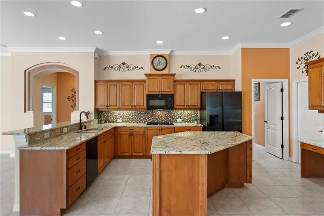 a bathroom with a granite countertop sink a mirror and a shower