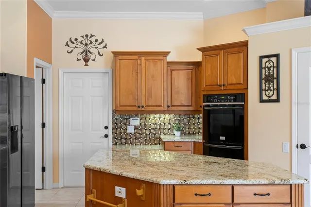 a view of an empty room with a window and a ceiling fan