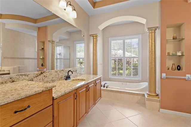 an aerial view of a house with a lake view