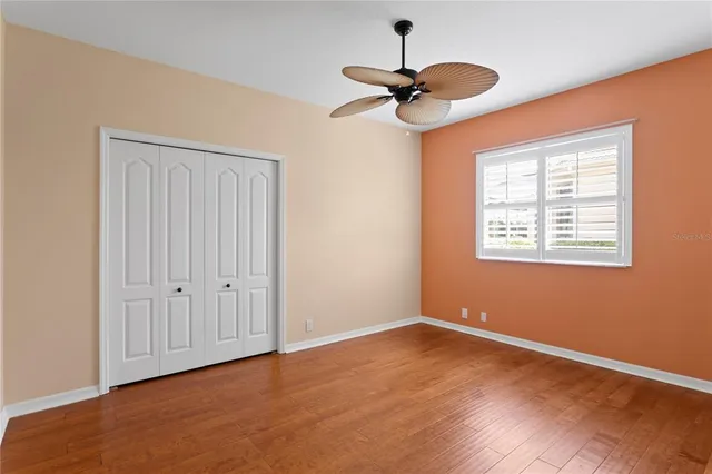 a view of a white house with a swimming pool