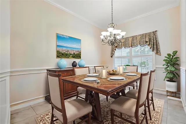 a kitchen with granite countertop a refrigerator a stove and wooden cabinets