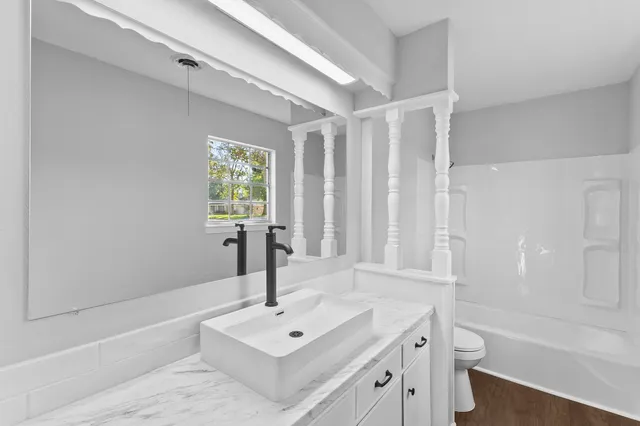 a bathroom with a sink and a bathtub