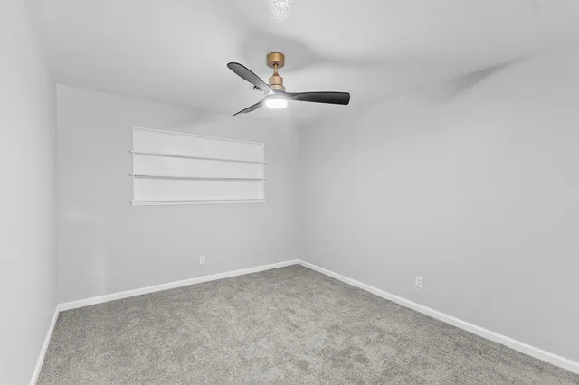 a view of a ceiling fan with wooden floor