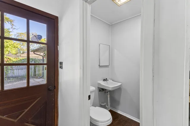 a view of a parking space in front of a house