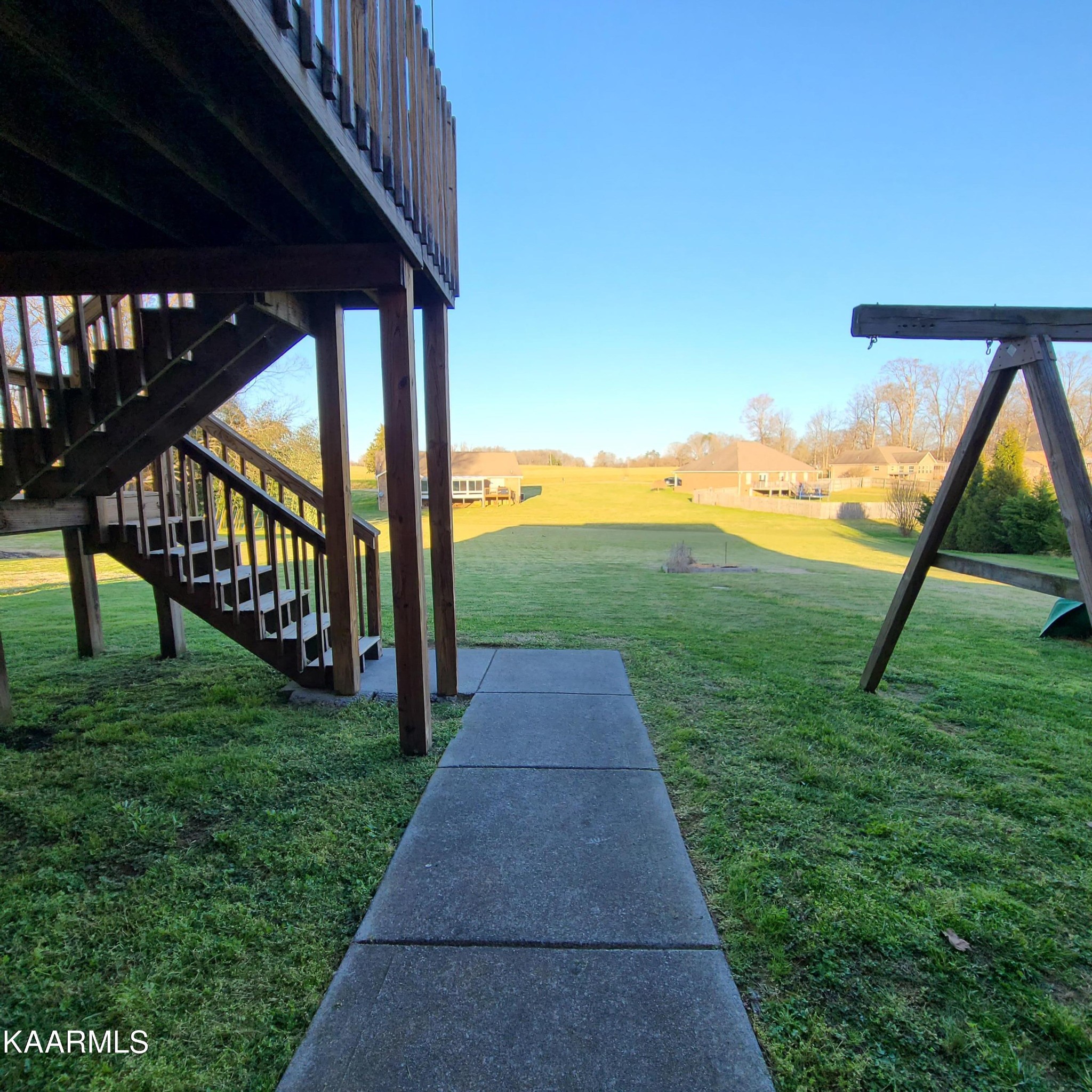 5631 J. Riley W Drive Greenback, TN 37742 - Photo 24 of 28 a view of a patio with a table & chairs