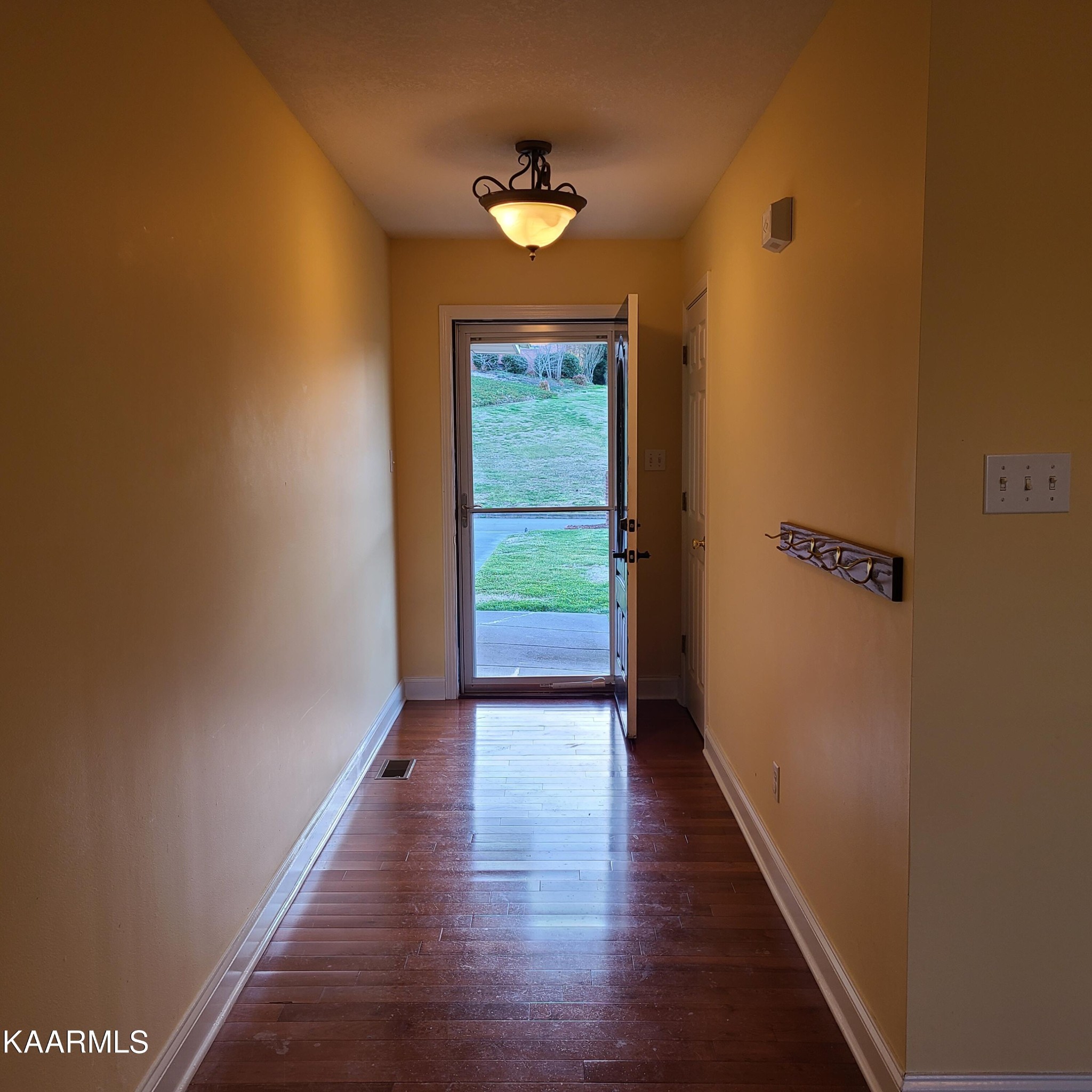 5631 J. Riley W Drive Greenback, TN 37742 - Photo 6 of 28 a view of a hallway with wooden floor