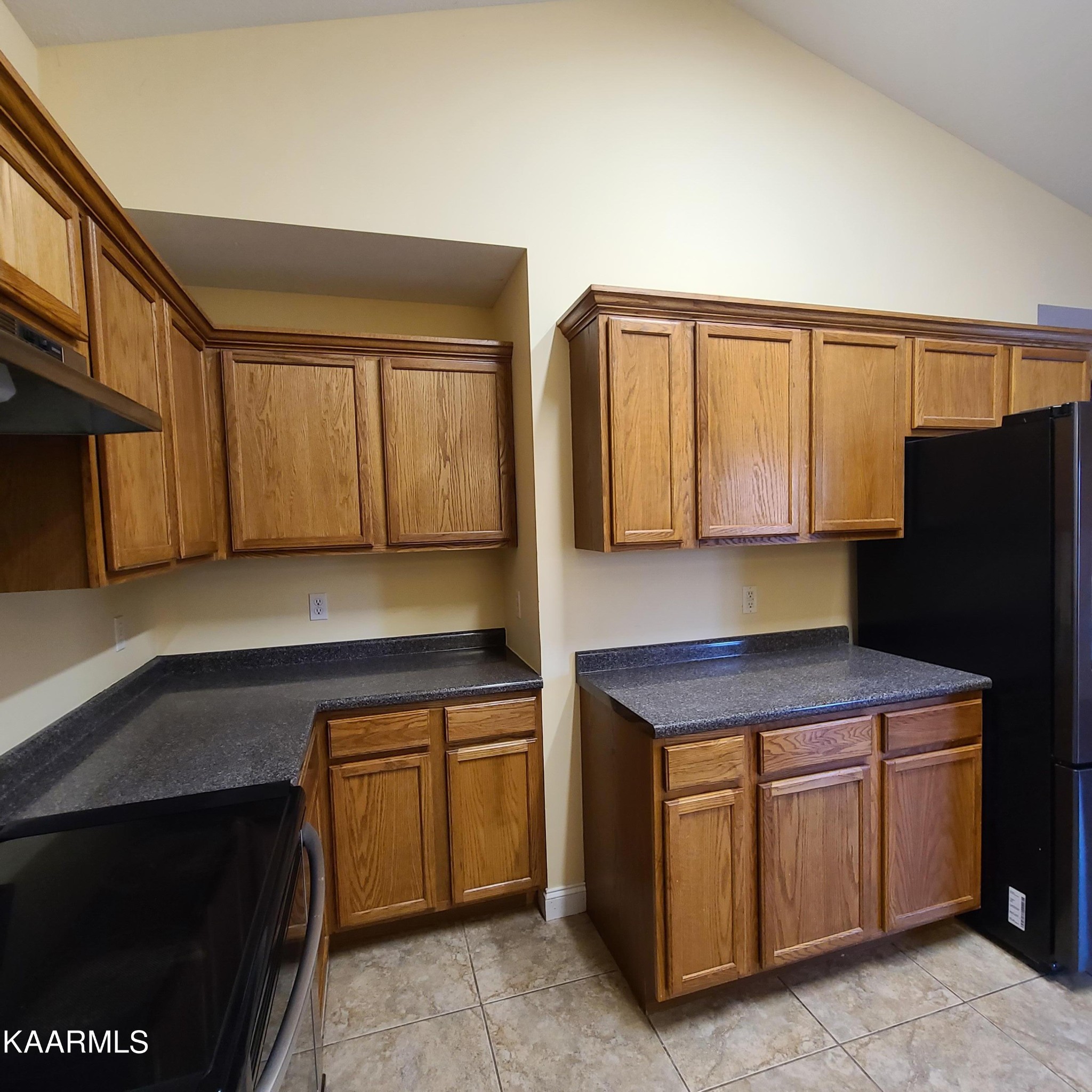 5631 J. Riley W Drive Greenback, TN 37742 - Photo 8 of 28 a kitchen with stainless steel appliances granite countertop a stove a refrigerator and a sink