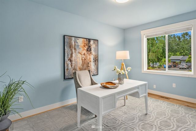 a workspace with furniture and a window