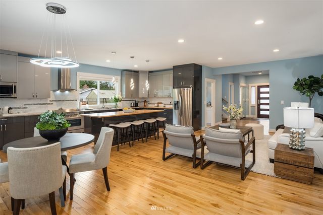 a kitchen with a table and chairs
