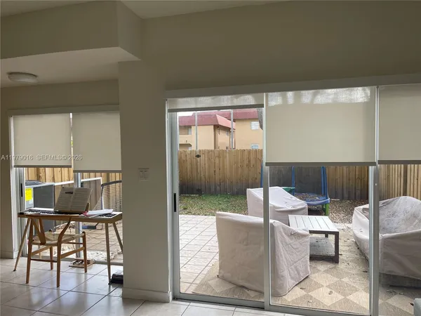 a living room with couches a coffee table and four dining room view