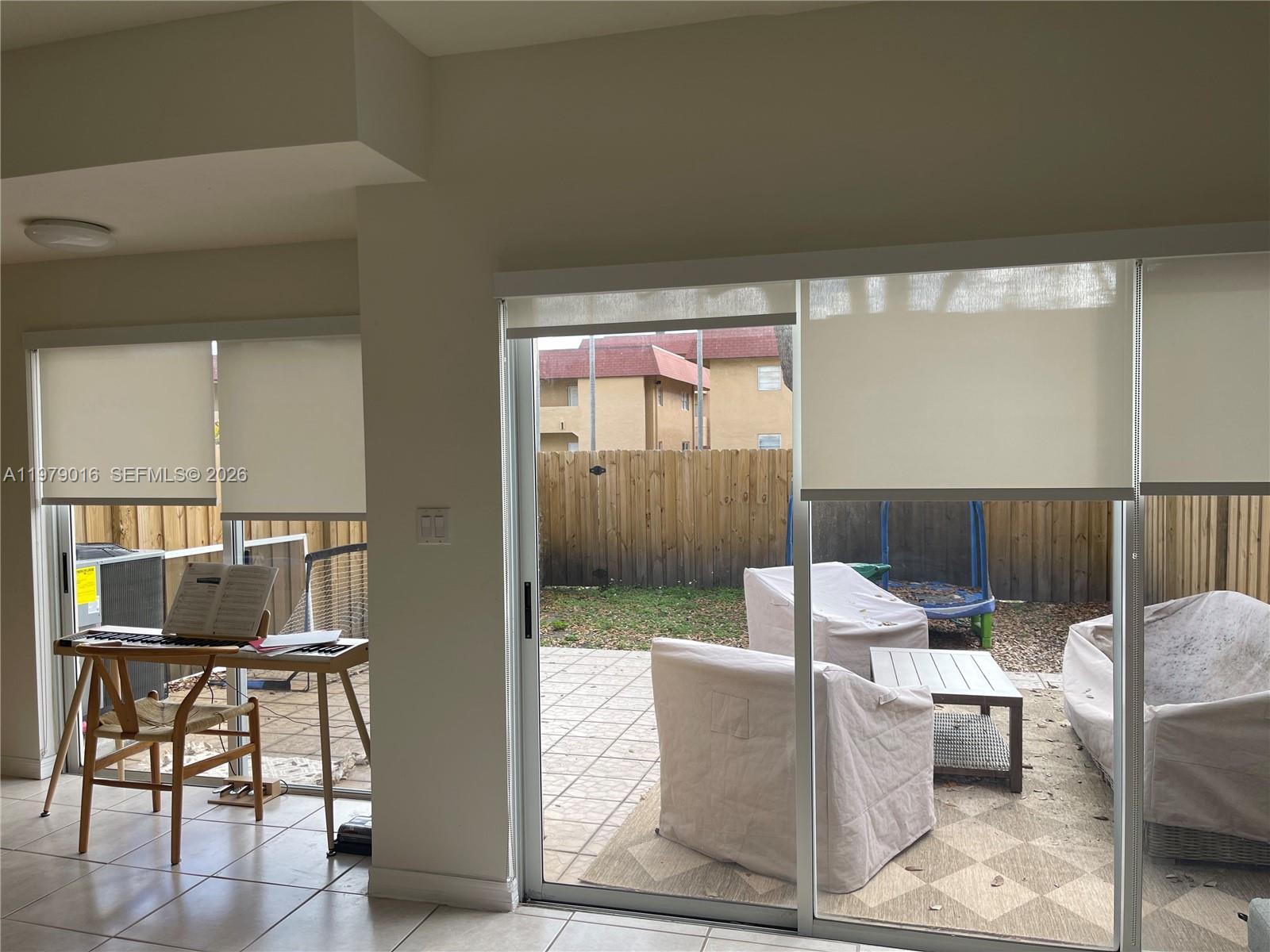 10160 Southwest 88th Street, Unit 201 Miami, FL 33176 - Photo 11 of 43 a living room with couches a coffee table and four dining room view