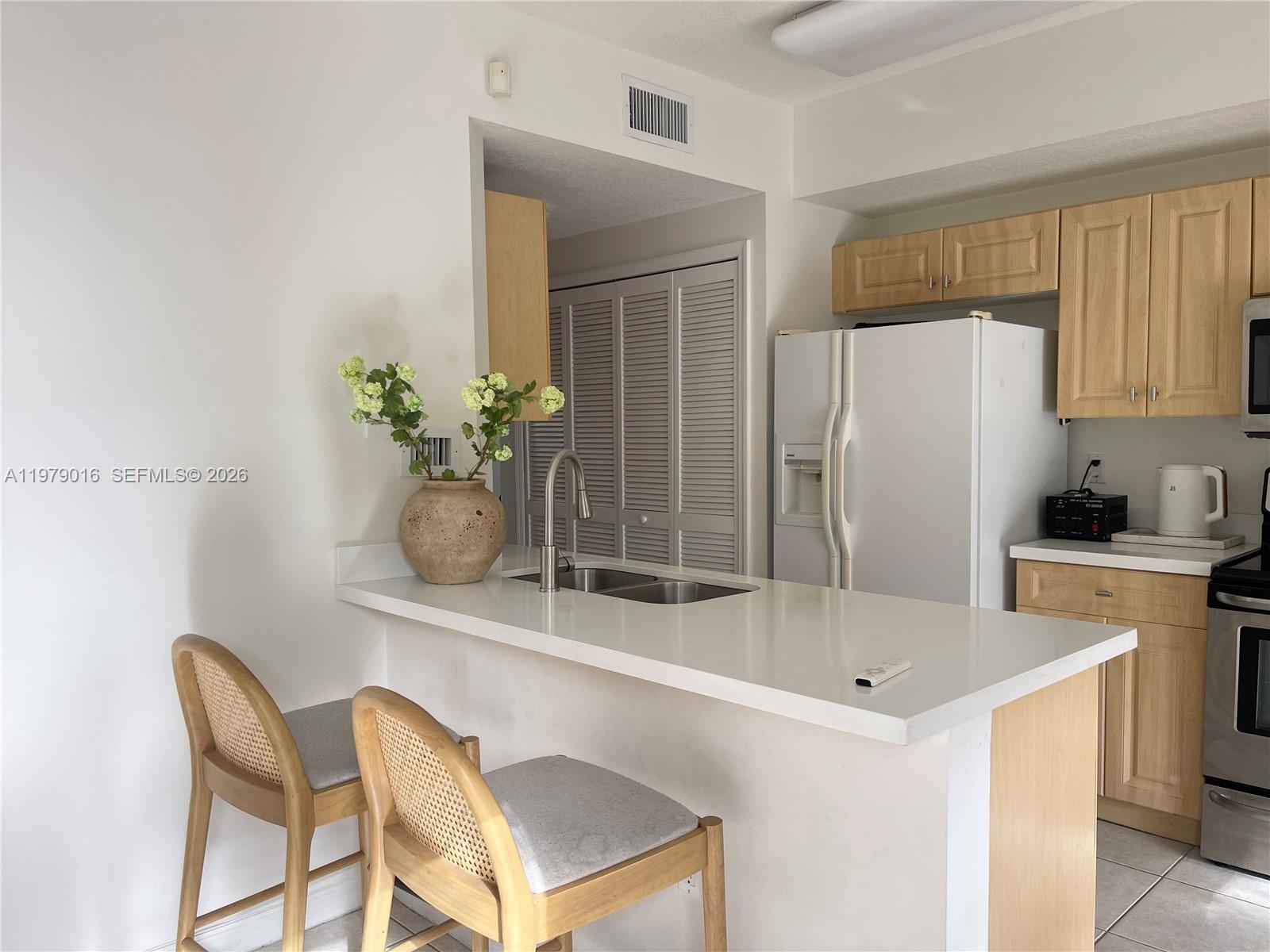 10160 Southwest 88th Street, Unit 201 Miami, FL 33176 - Photo 13 of 43 a white bath tub sitting in a bathroom next to a window