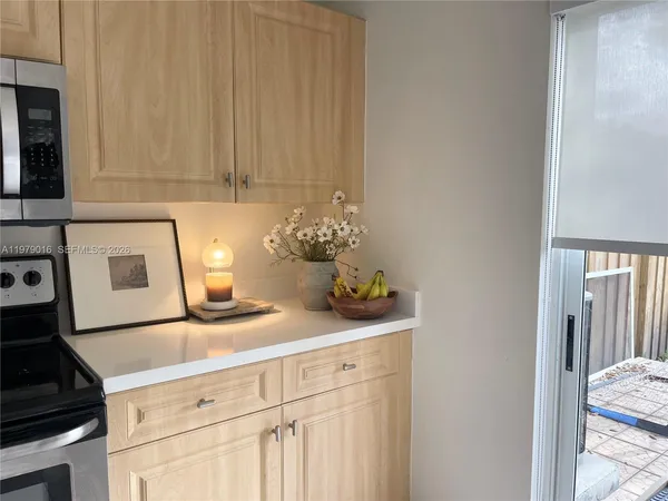 a kitchen with a sink and cabinets