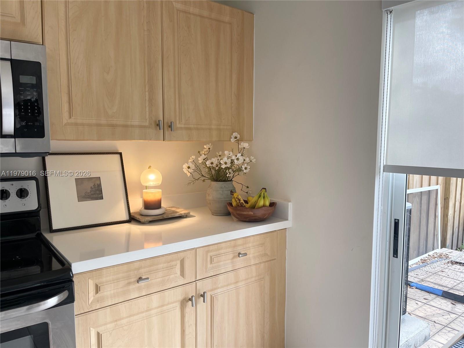 10160 Southwest 88th Street, Unit 201 Miami, FL 33176 - Photo 14 of 43 a kitchen with a sink and cabinets