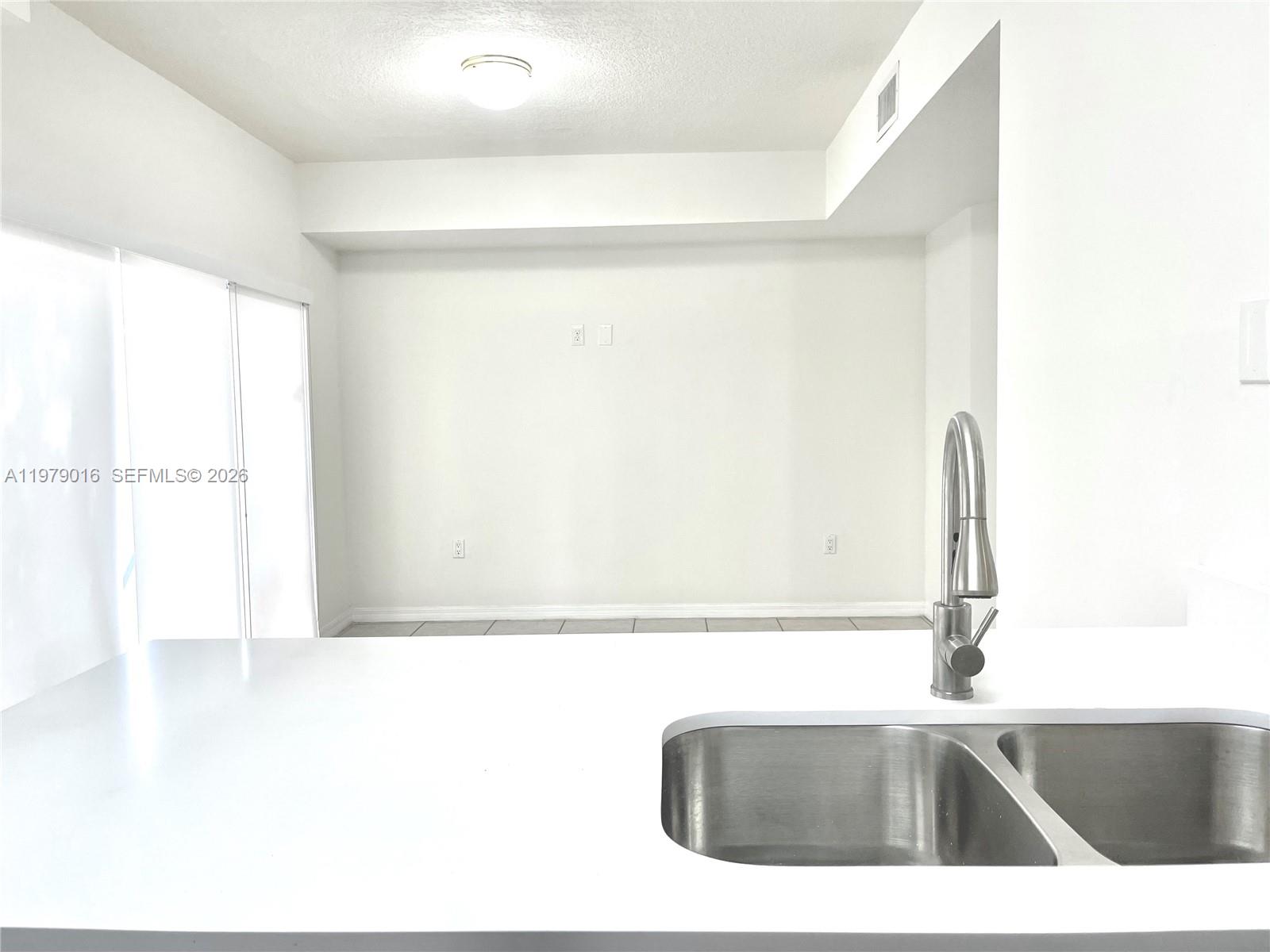 10160 Southwest 88th Street, Unit 201 Miami, FL 33176 - Photo 20 of 43 a bathroom with a sink and a mirror