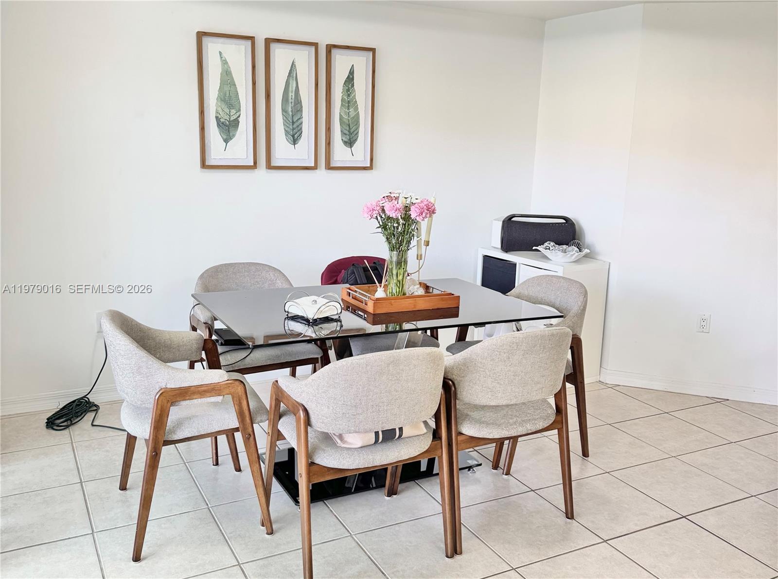 10160 Southwest 88th Street, Unit 201 Miami, FL 33176 - Photo 21 of 43 a dining room with furniture and wooden floor