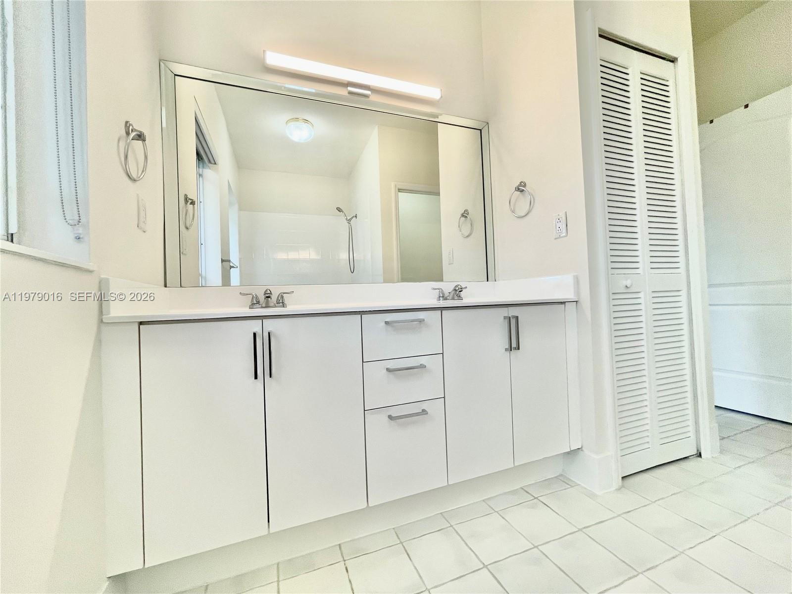 10160 Southwest 88th Street, Unit 201 Miami, FL 33176 - Photo 26 of 43 wooden floor with white cabinets