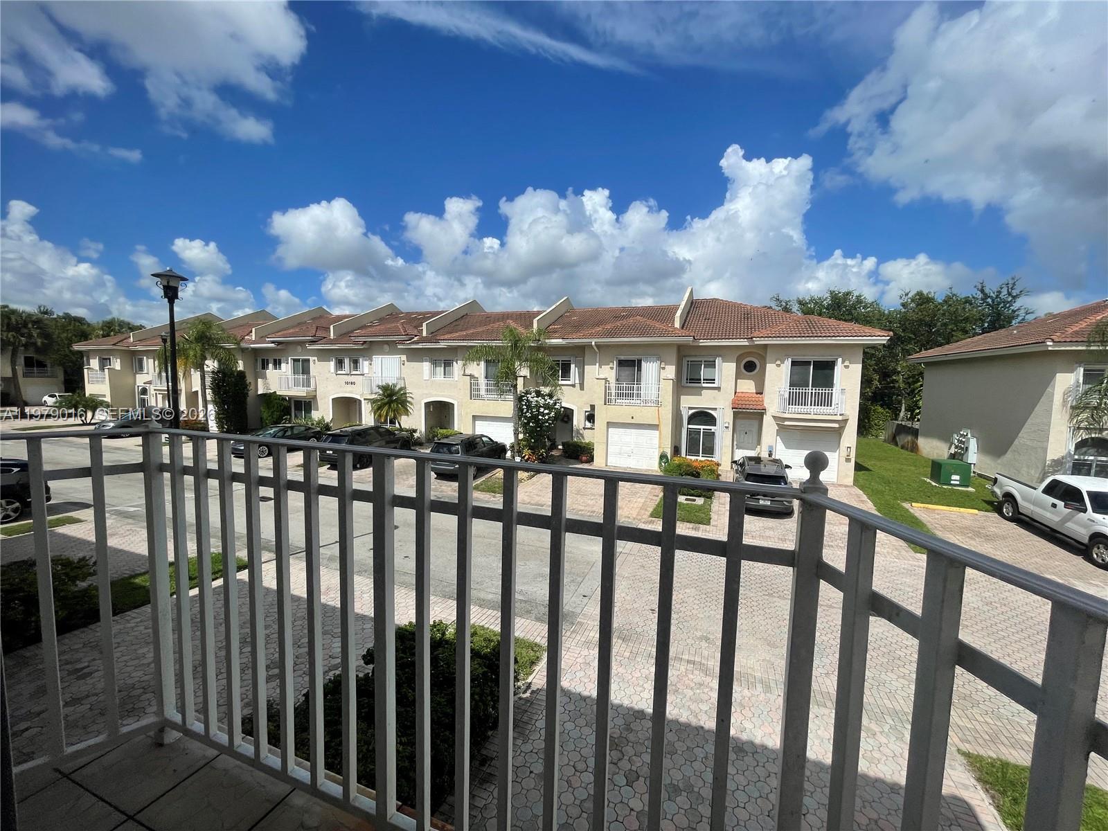 10160 Southwest 88th Street, Unit 201 Miami, FL 33176 - Photo 32 of 43 a view of a house with a balcony