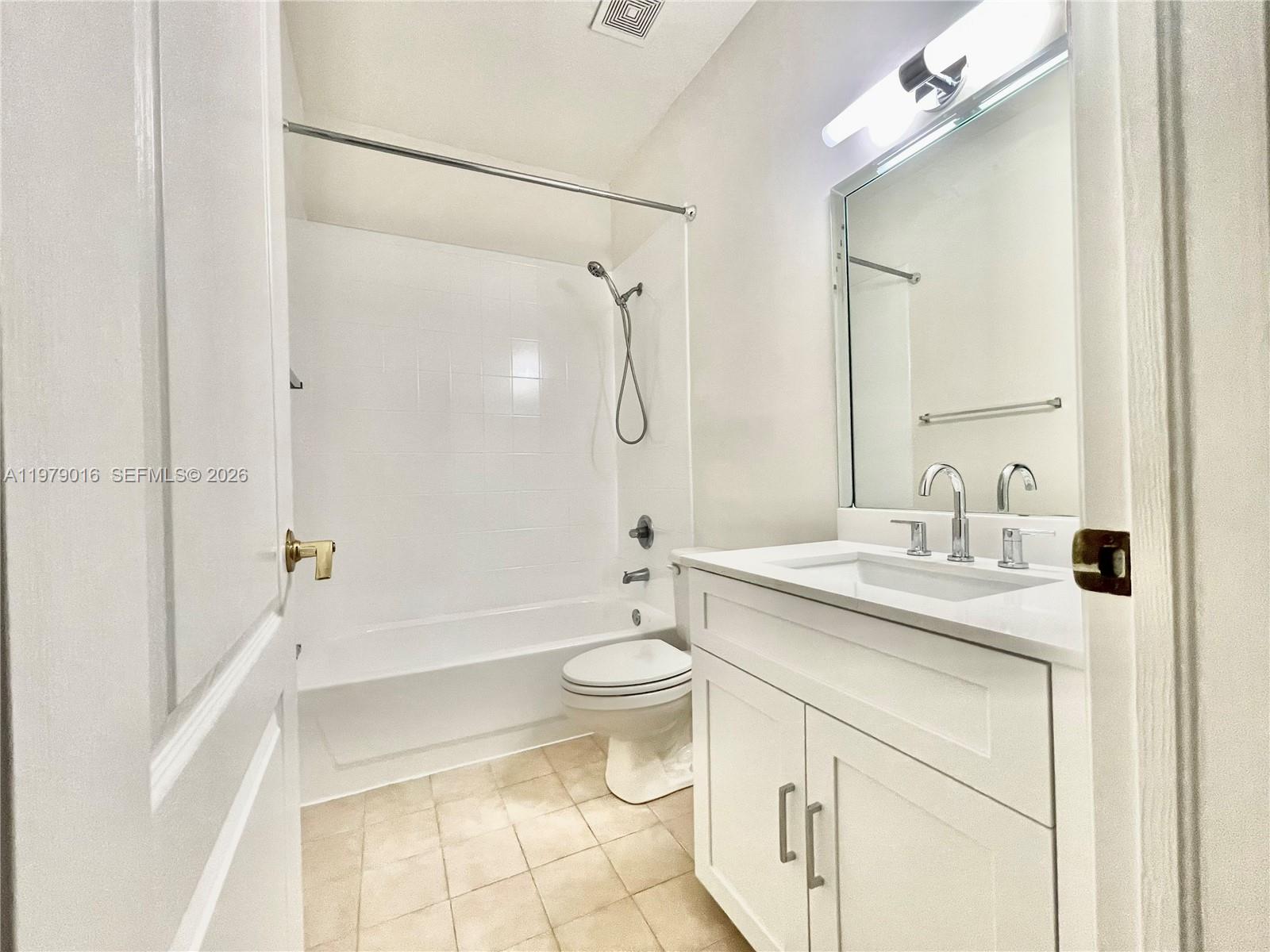 10160 Southwest 88th Street, Unit 201 Miami, FL 33176 - Photo 36 of 43 a bathroom with a granite countertop sink toilet and shower