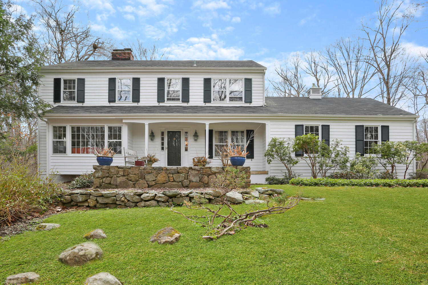190 Briscoe Road New Canaan, CT 06840 - Photo 2 of 21 a front view of house with yard and green space