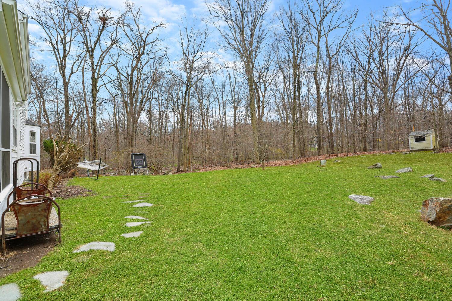 190 Briscoe Road New Canaan, CT 06840 - Photo 12 of 21 a backyard of apartments with large trees