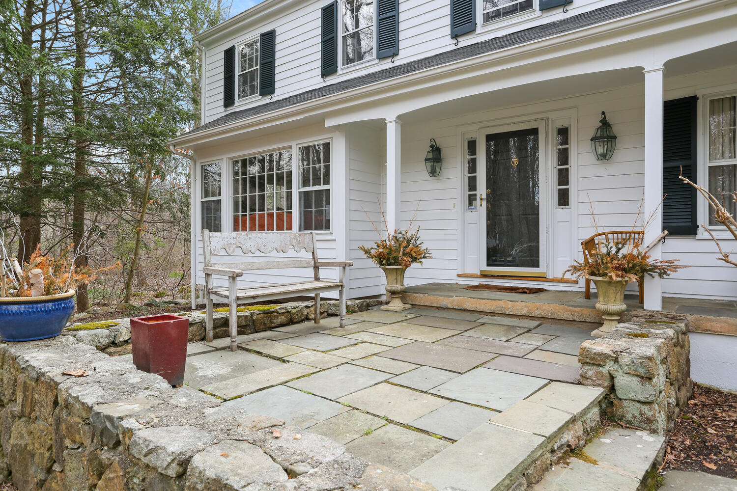 190 Briscoe Road New Canaan, CT 06840 - Photo 14 of 21 a view of a patio with table and chairs and wooden fence