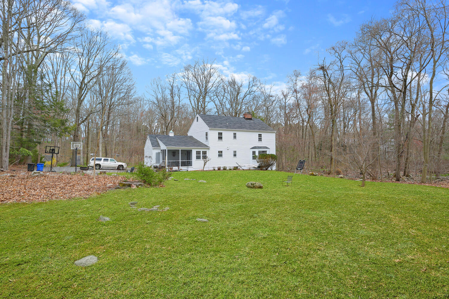 190 Briscoe Road New Canaan, CT 06840 - Photo 19 of 21 a view of a house with backyard and garden