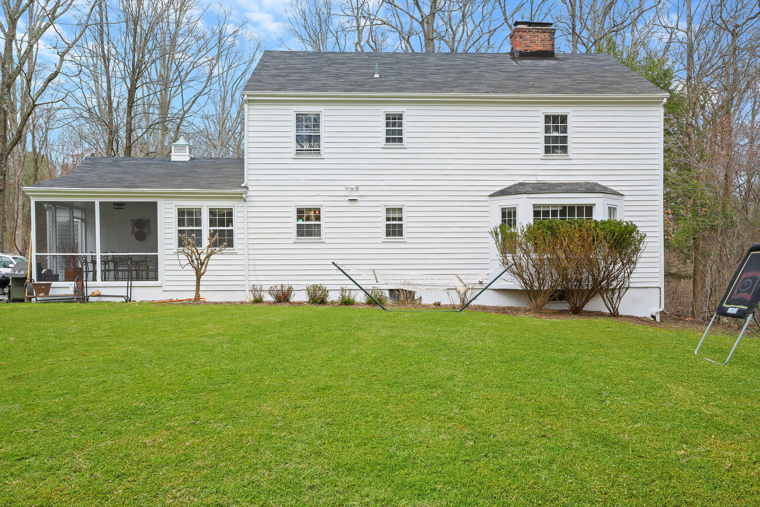 190 Briscoe Road New Canaan, CT 06840 - Photo 3 of 21 a front view of a house with garden