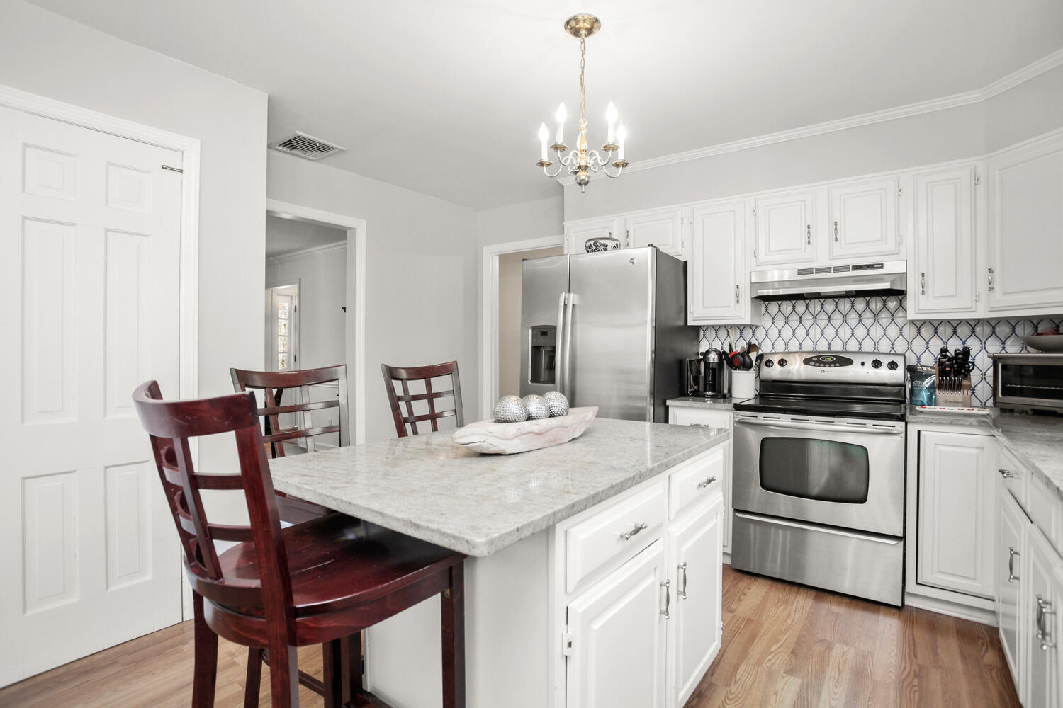 190 Briscoe Road New Canaan, CT 06840 - Photo 9 of 21 a kitchen with a table chairs sink and cabinets