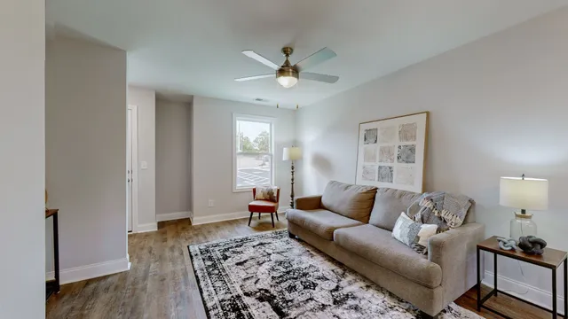 a living room with furniture and a rug