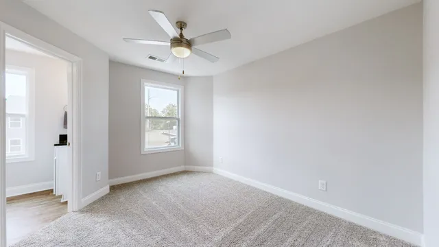 a view of an empty room with a window