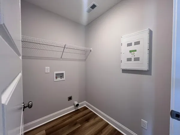 a view of a room with rack on the wall