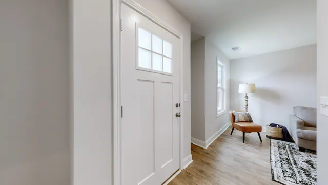 a view of a livingroom with furniture and wooden floor