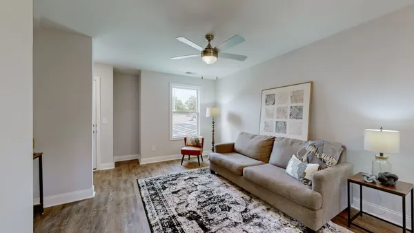 a living room with furniture and a rug