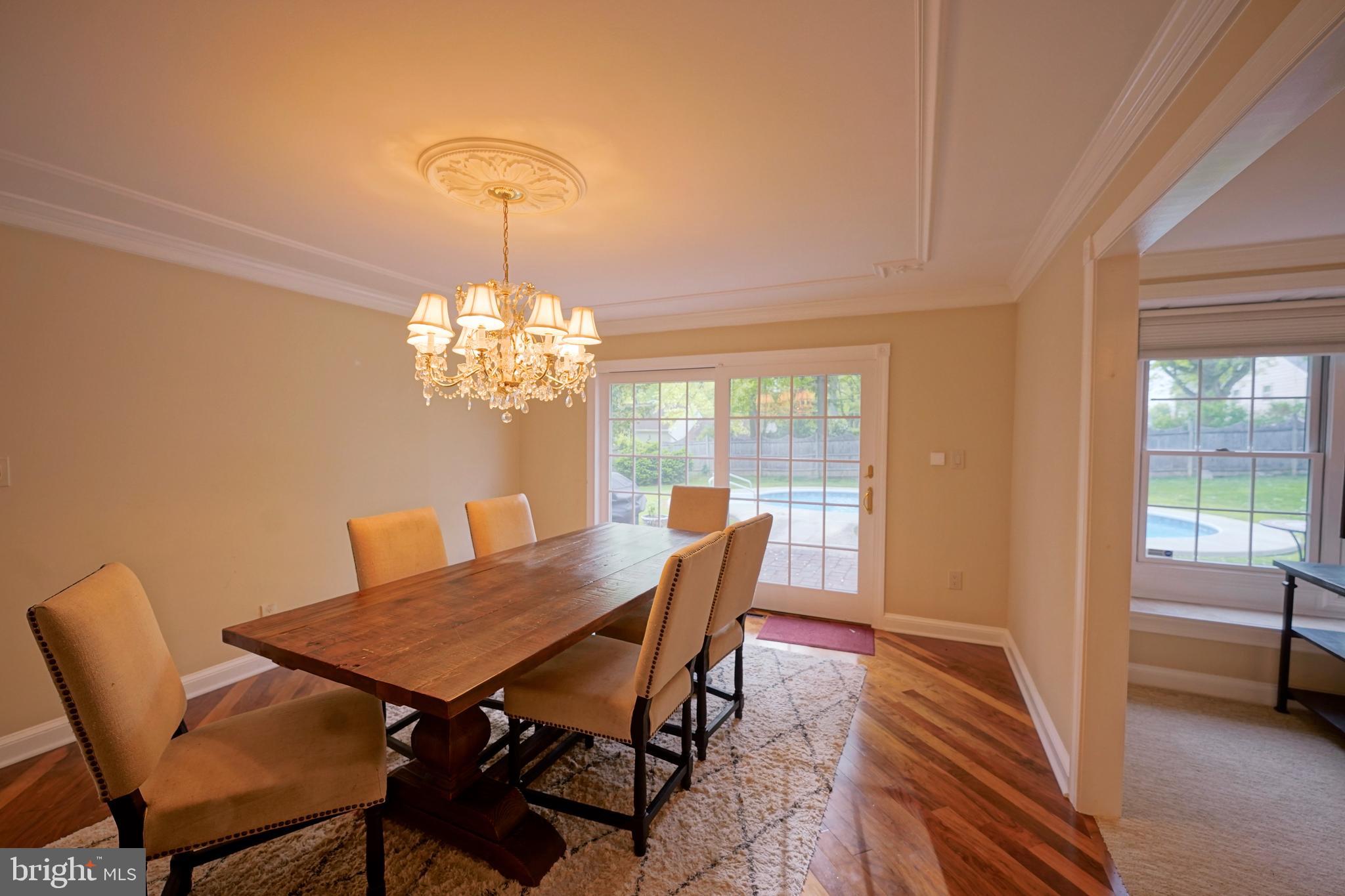 40 Covered Bridge Road Cherry Hill, NJ 08034 - Photo 14 of 52 a view of a dining room with furniture a chandelier and wooden floor