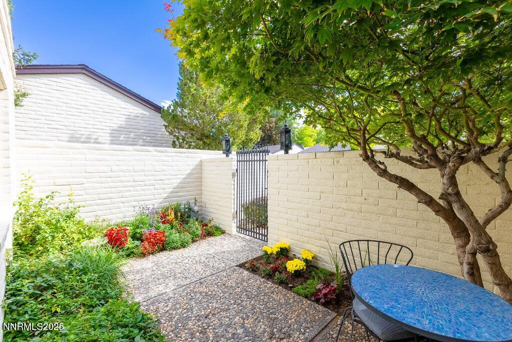 4811 Lakeridge Terrace West Reno, NV 89509 - Photo 3 of 43 a view of a chairs and table in a backyard