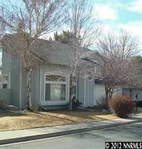 2772 Starr Meadows Loop Reno, NV 89519 - Photo 1 of 1 a view of street along with house and trees
