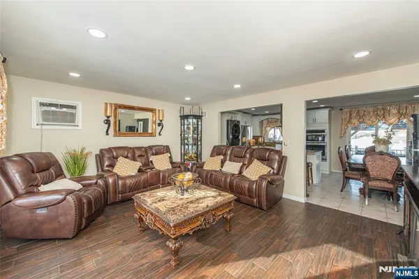 a living room with furniture or couch and a wooden floor