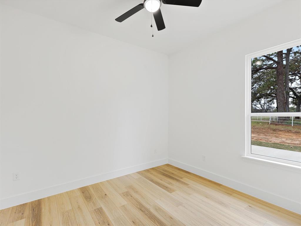544 Shepherd Road Combine, TX 75159 - Photo 28 of 36 Spare room with light wood-type flooring and ceiling fan