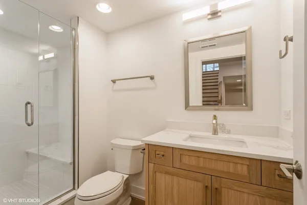 a bathroom with a window and a shower