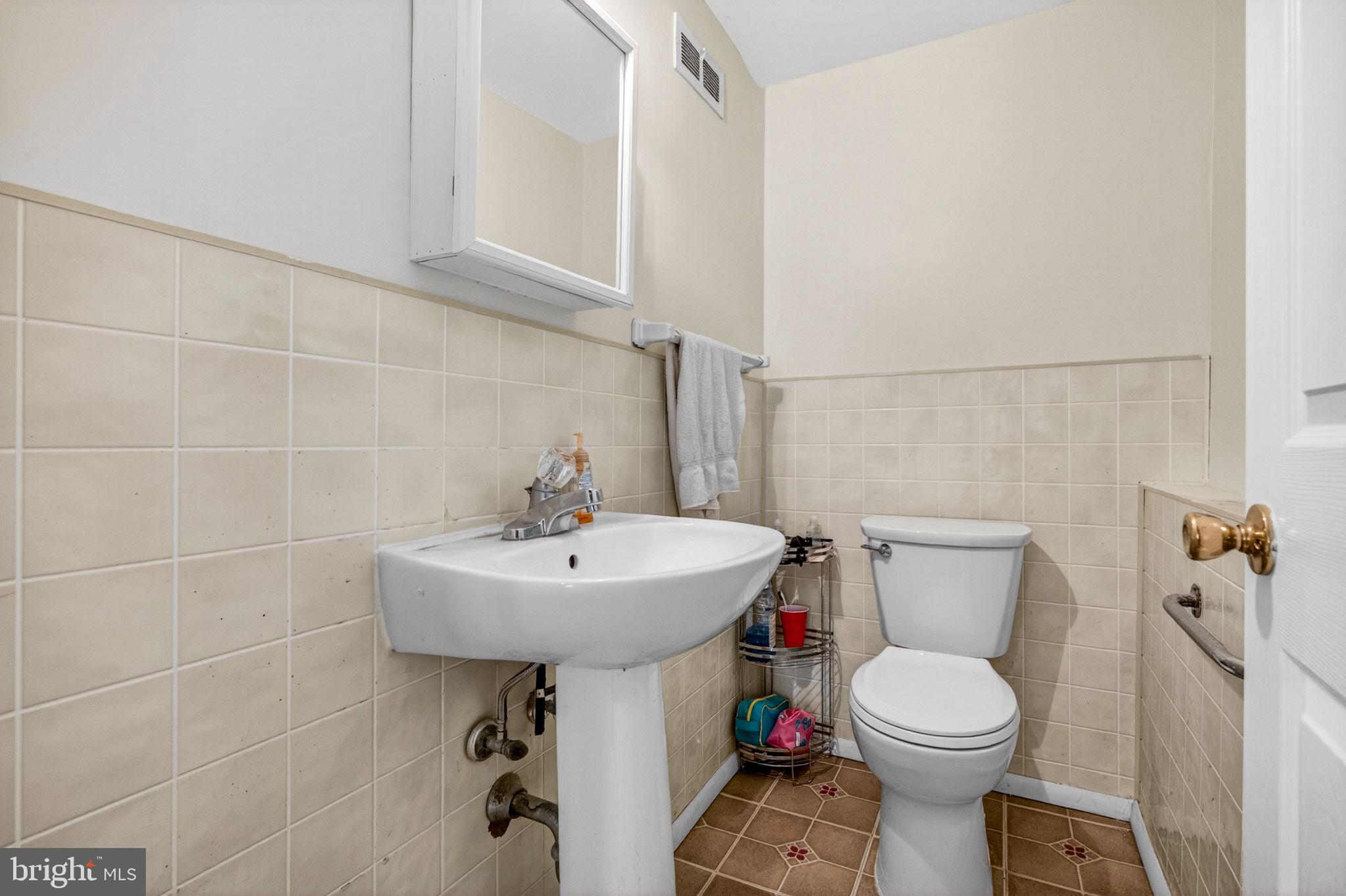 46 Trinity Avenue Marlton, NJ 08053 - Photo 24 of 37 a bathroom with a toilet sink and mirror