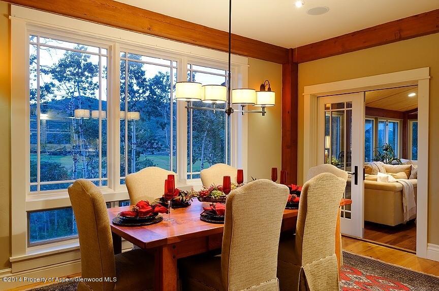 501 Greenfield Road Basalt, CO 81621 - Photo 12 of 36 a dining room with furniture and a floor to ceiling window