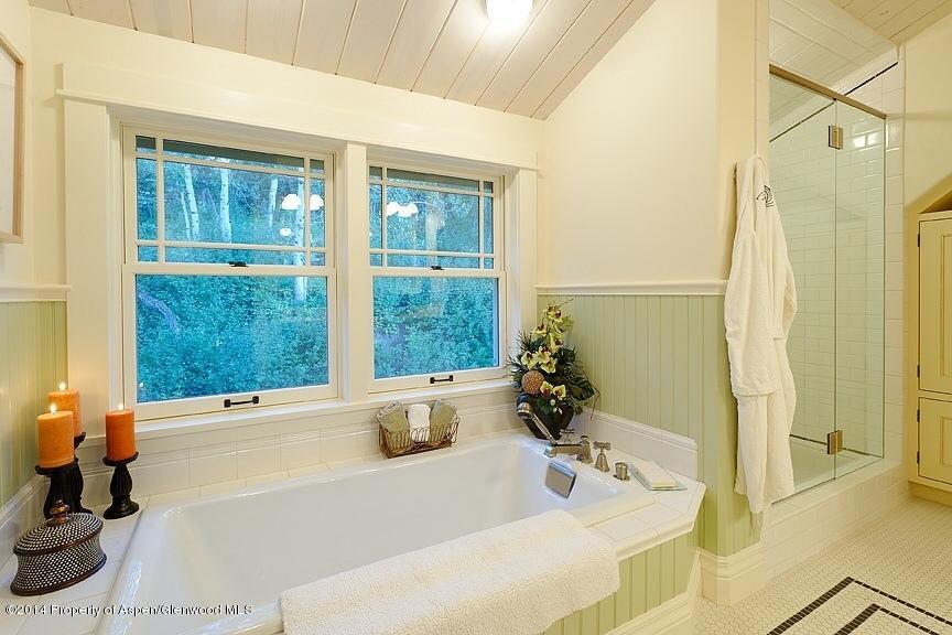 501 Greenfield Road Basalt, CO 81621 - Photo 17 of 36 a bath tub sitting next to a bathroom sink