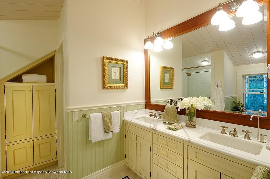 501 Greenfield Road Basalt, CO 81621 - Photo 18 of 36 a bathroom with a double vanity sink and mirror